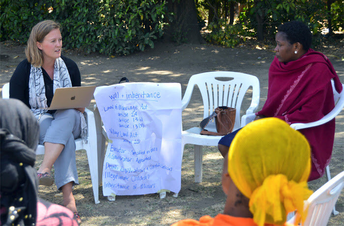 A Projects Abroad Human Rights intern discusses inheritance rights with local women in Tanzania